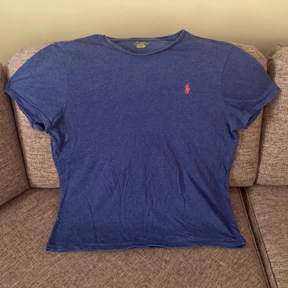 Blue Polo T-shirt with red symbol on chest